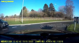 Close Call: Two Vehicles Miscalculate Distance Nearly Crashing at a Roundabout