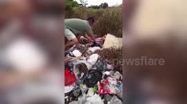 Abandoned baby girl found alive in rubbish pile in Indonesia