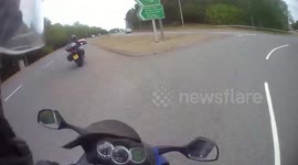 Close Call: Biker On the Right Lane Makes a Wrong Turn Almost Causing an Accident