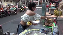Street food seller carries on serving roti despite orders to leave pavement spot