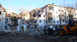 Officials inspect rubble of building destroyed by missile strike in Zaporizhzhia