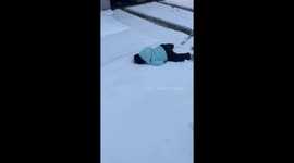 Toddler hilariously faceplants in the snow