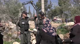 Israeli bulldozers demolish a Palestinian-owned house in West Bank city of Hebron