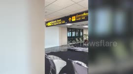 Tourists shocked by water leak covering walkway at Bangkok airport