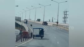 Loose wheel from truck bounces along road