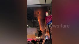 High-rise building in Hong Kong goes up in huge flames and is left seriously damaged