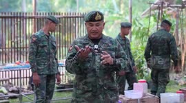 American soldiers hold snakes at Cobra Gold military training in Thailand