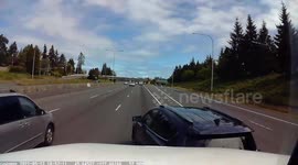 Close Call: Car Changing Lanes on Highway Nearly Flattened by Oncoming Truck