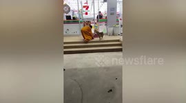 Pet dog hilariously runs away from Buddhist monk trying to return it to temple