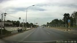 Out-of-control truck crashes onto car waiting at red light stop