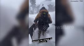 Group treks through WALLS of snow in California to reach their favourite sushi spot