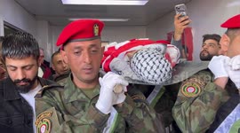 Mourners take part in the funeral of Palestinian youth Mohammad Slim, 15, shot dead by Israeli troops a day earlier, in his village of Azzun in the West Bank