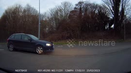 Careless driver nearly causes an accident when they fail to give way at a roundabout
