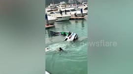 BMW crashes into sea after driver accidentally reverses off pier in China