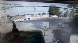 Hero motorcycle rider pulls boy from road in front of oncoming car
