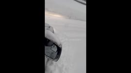 Driver braves 10-foot snowmageddon as California blasted by winter storm