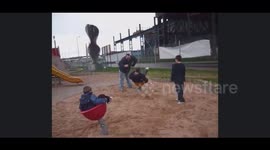 Darren is spinning Gary on a kids park then ends up getting really dizzy and nearly falls