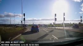 Motorcyclist falls off his bike while attempting risky stunt on roundabout