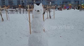 Children build snowmen amid frosty winter weather in Russia
