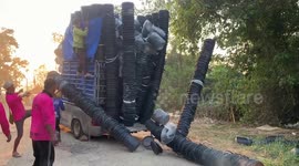 Hundreds of buckets fall from the back of overloaded pickup truck