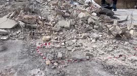 Palestinian family stands amid rubble of their house after it was demolished by Israeli military bulldozers