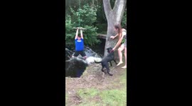 Dog blocks kids rope swing adventure and nearly makes him fall in the river.