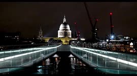 People walking towards St Paul's Cathedral over Millenium Bridge, London, United Kingdom