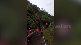 Large rocks crash down mountain road after earthquake triggers landslide in Philippines