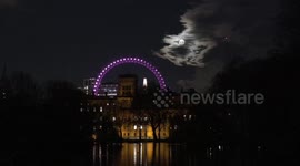 The March Full Moon known as the Worm Moon rises by the Iconic London Eye