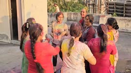 A group of women celebrate Holi in South India
