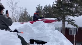 Winter weather in California sees residents kayak off their snow-covered houses