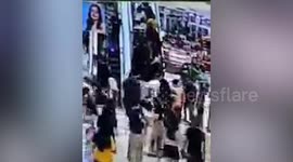 Twenty injured when 'overloaded' escalator slides backward in mall