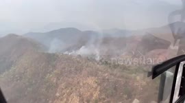 Helicopters battle fires started by farmers in northern Thailand