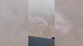 Thick smoke billows over burning forest as air pollution worsens in Thailand