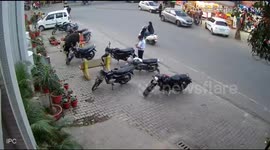 Elderly man flung into air by agitated bull on street in northern India