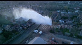 Drone footage captures water shooting high into the air over houses in Beeston, Notts after burst pipe causes chaos