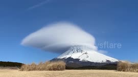 Spectacular cloud disc swirls round Mount Fuji in timelapse footage