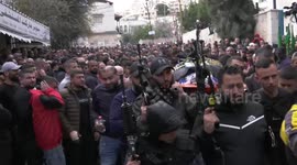 Mourners carry the bodies of Palestinians who were killed in an Israeli raid, during their funeral in the West Bank city of Jenin.