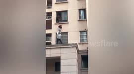 Real-life Spider-Man scales building in China to rescue toddler who fell out window