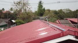 Fed-up residents install sprinkler on roof to fight air pollution