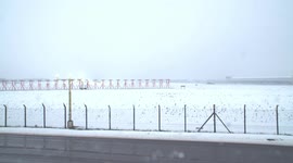 East Midlands airport closes runway due to heavy snow - Derbyshire, UK