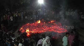 Locals brave burning embers in holy ritual for Holi celebrations in Gujarat