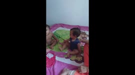 Two children playing on the bed    cute Indian little children playing on the bed