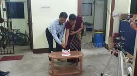 Happy anniversary cake cutting in home .   Lovely couple cutting their Indian wedding anniversary cake