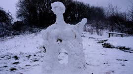 Funny moment the head unexpectedly falls off a naked transgender snow person with male & female anatomy