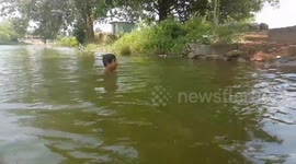 Village boys jumping to pond  lifestyle village boys . Super jump to pond by village boy