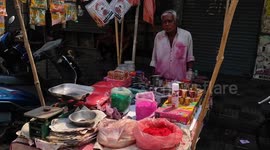 Thousands of shirtless men play with colorful Holi in Prayagraj, India