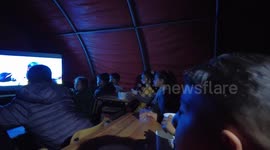 Turkish children gather inside tent to watch cartoons amidst earthquake aftermath