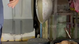 Huge 15ft long king cobra caught behind family's washing machine