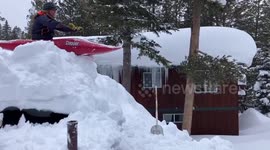 California residents take to snowy roads in canoes